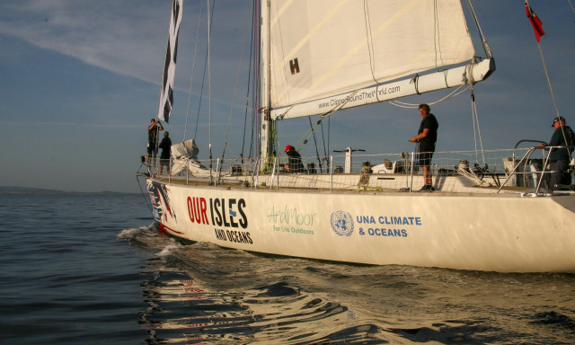 A Clipper 68 training yacht with the UNA Climate and Oceans Logo