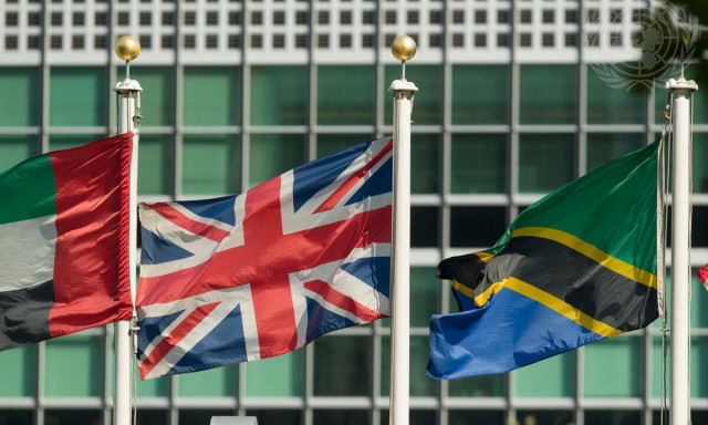 The flag of the United Kingdom of Great Britain and Northern Ireland (centre) flying at United Nations headquarters in New York.