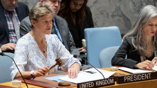 Ambassador Barbara Woodward (left of two people at table), Permanent Representative of the United Kingdom to the United Nations and President of the Security Council for the month of July 2023, chairs the Security Council meeting on the situation in the Middle East, including the Palestinian question