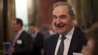 smiling man in suit and tie