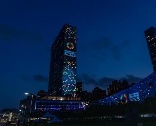 A landmark launch of Scoring for the Goals event with projection of images of Sustainable Development Goals on the UN Building.
